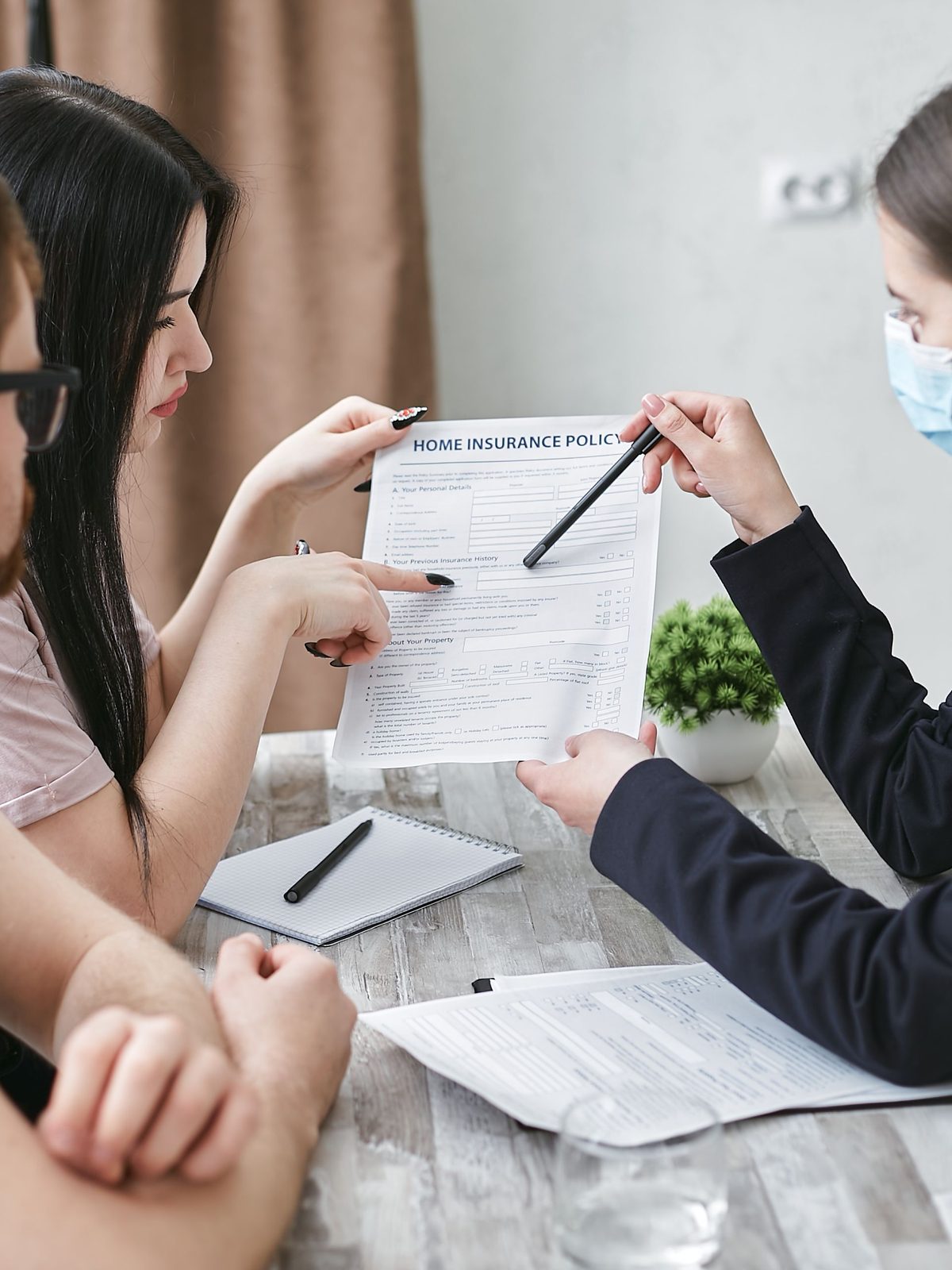 Two people going through an insurance document